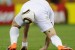 England's striker Wayne Rooney bends down during their Group C first round 2010 World Cup football match on June 18, 2010 at Green Point stadium in Cape Town. NO PUSH TO MOBILE / MOBILE USE SOLELY WITHIN EDITORIAL ARTICLE AFP PHOTO / JEWEL SAMAD