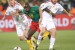 Cameroon's striker Achille Emana (C) fights for the ball with Denmark's defender Simon Kjaer (L) and Denmark's midfielder Daniel Jensen during the Group E first round 2010 World Cup football match Cameroon vs. Denmark on June 19, 2010 at Loftus Verfeld stadium in Tshwane/Pretoria. NO PUSH TO MOBILE / MOBILE USE SOLELY WITHIN EDITORIAL ARTICLE - AFP PHOTO / VALERY HACHE