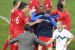 England's coach Fabio Capello (L) shakes hands with Slovenia's defender Miso Brecko (R) as England's players celebrate at the end of the Group C first round 2010 World Cup football match Slovenia vs. England on June 23, 2010 at Nelson Mandela Bay stadium in Port Elizabeth. England defeated Slovenia 1-0. NO PUSH TO MOBILE / MOBILE USE SOLELY WITHIN EDITORIAL ARTICLE - AFP PHOTO / LIU JIN