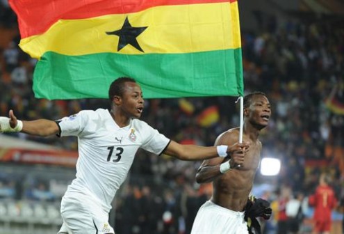 File Photo: Ghana's midfielder Andre Ayew (L) and Ghana's defender John Paintsil: celebrating another Ghana triumph 