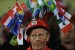 A Switzerland supporter waits for the start of the Group H first round 2010 World Cup football match Switzerland vs. Honduras on June 25, 2010 at Free State Stadium in Mangaung/Bloemfontein. NO PUSH TO MOBILE / MOBILE USE SOLELY WITHIN EDITORIAL ARTICLE - AFP PHOTO / PIERRE-PHILIPPE MARCOU