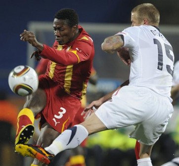 Ghana's striker Asamoah Gyan (L) fights for the ball with US  defender Jay DeMerit during the 2010 World Cup round of 16 football  match USA vs. Ghana on June 26, 2010 at Royal Bafokeng stadium in  Rustenburg. - AFP PHOTO / JAVIER SORIANO