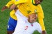 Brazil's defender Juan (L) and Chile's striker Humberto Suazo fight for a headder during the 2010 World Cup round of 16 football match Brazil vs. Chile on June 28, 2010 at Ellis Park stadium in Johannesburg. NO PUSH TO MOBILE / MOBILE USE SOLELY WITHIN EDITORIAL ARTICLE - AFP PHOTO / FRANCOIS-XAVIER MARIT