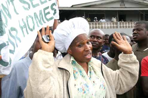 â€¢Mrs. Adefowora, one of the landladies and others protesting this morning over the demolition of their houses in Awori area of Abule-Egba, Lagos. PHOTO:OLATUNJI OBASA.