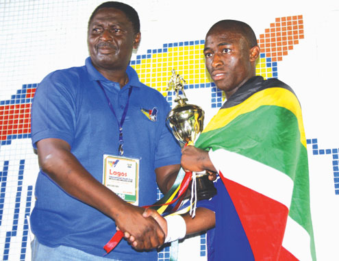 REWARD… Ngidi receives his award from Godson Uti.