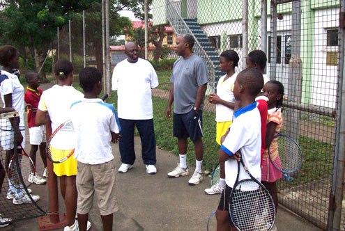 COURTESY CALL…Boss of EIP Ebosie Foundation, Dr. Ebosie (right) addresses the Onigbongbo Tennis Academy kids during a courtesy call at their Military Cantonment training ground in Ikeja, Lagos, Nigeria, while the council chairman, Idowu Obasa looks on.