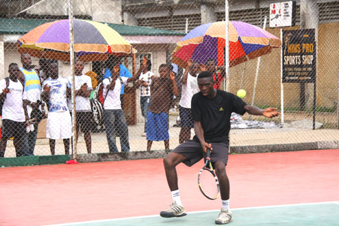 Sunday Otu returns a serve to an apponent during a match at the last CBN Open in Lagos, Nigeria. Photo: Akin Farinto.