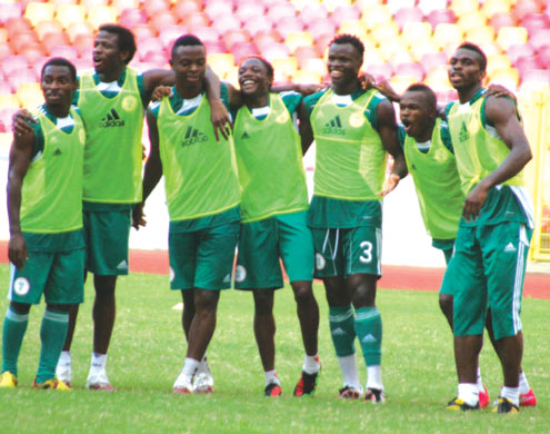ECSTACY… Super Eagles skipper, Joseph Yobo (far right) and other players in an expectant mood after their training at the Abuja National Stadium yesterday. The Eagles believe the FIFA ban on Nigeria will be lifted today. Photo: Femi Ipaye.