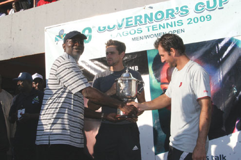 FLASHBACK…Gov. Babatunde Fashola (left) presents the Men’s Doubles trophy to the duo of Catalin-Iount Gurd (middle) and John Paul Fruttero (right) during last year’s final. Photos:Akin Farinto.