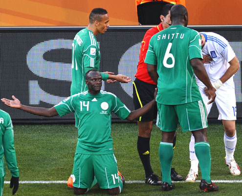 GUILTY… Nigeria’s Sani Kaita on his knees after being red-carded following his kick against Greek player Vasileios Torosidis during the World Cup in South Africa. Kaita is back in the Super Eagles.