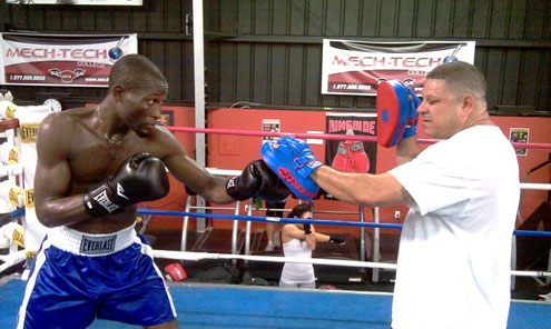 IN TRAINING... Okedara in training with his coach in America.