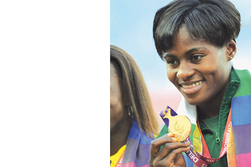 Osayemi displaying the gold medal she won at the tournament.