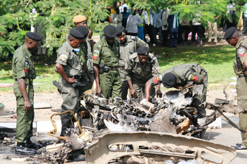 Special ant-bomb Police squrd working on the mean vehicle the bomb was planted.