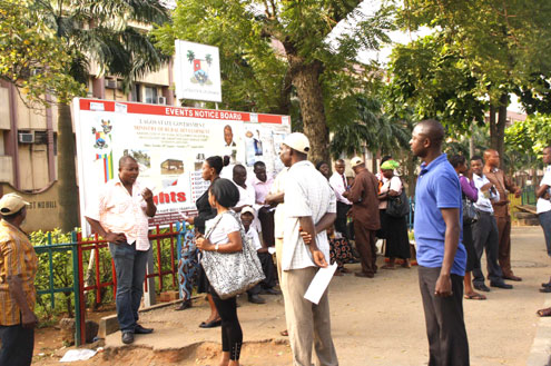 Some civil servants locked out of Alausa Secreteriat this morning. PHOTO: IDOWU OGUNLEYE & EMMANUEL OSODI.