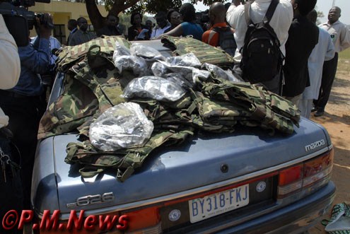 The undetonated wired car and recovered military wares.