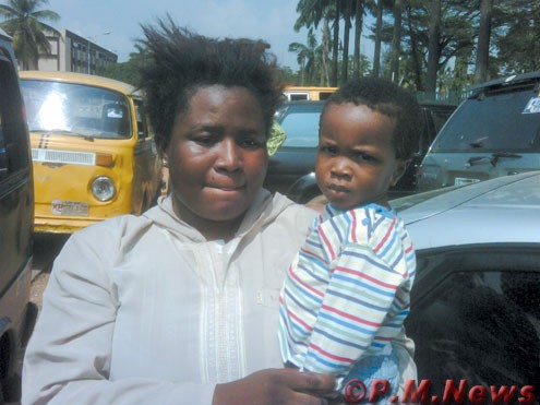 Mrs. Tomilola Olayiwola and her child.