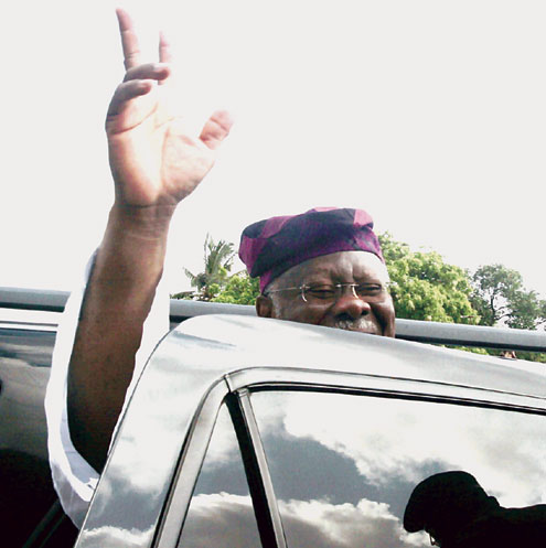 Bode George acknowledging cheers from PDP supporters soon after he came out of Kirikiri prison last Saturday. PHOTO: Idowu Ogunleye.
