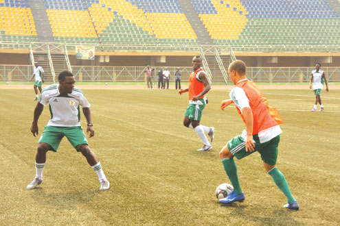 MIND GAME…West Bromâ€™s striker, Osaze Odemwingie (right) tries to dribble Chibuzor Okoronkwo (left) during the Eaglesâ€™ training ahead of the friendly match against Sierra Leone at the Teslim Balogun Stadium, Lagos. Photo: Emmanuel Osodi.