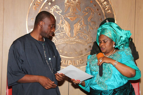 Dame Patience Jonathan, Nigeriaâ€™s First Lady presenting a condolence letter to Rt. Hon. Chibuike Rotimi Amaechi, Governor of Rivers State during her condolence visit to Rivers State.