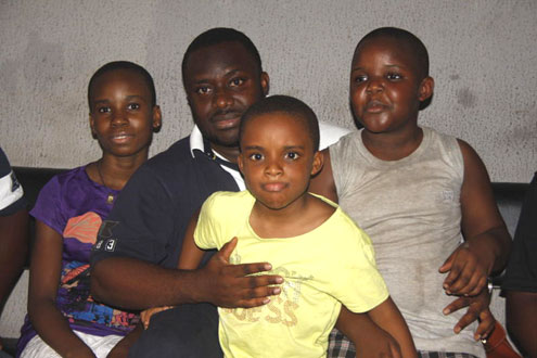 The lucky kids, after re-uniting with their father yesterday. PHOTO: Emmanuel Osodi.