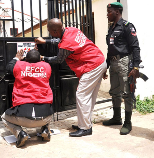 EFCC Operatives sealing one of the Igbinedion properties located at Asokoro, Abuja.