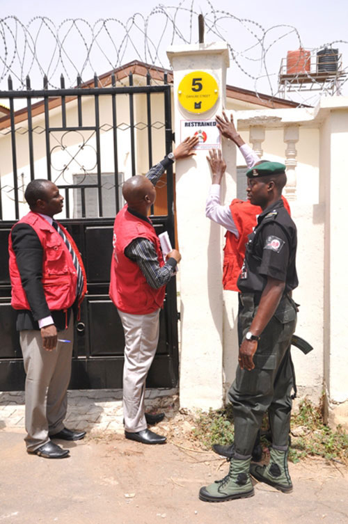 EFCC Operatives sealing one of the Igbinedion properties located at Asokoro, Abuja.