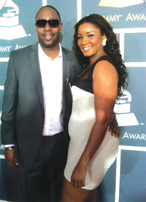 Omotola being cuddled by a guy during the Grammy Awards in U.S., recenlty.