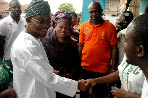 Osun State Governor, Ogbeni Rauf Aregbesola (left) and his wife, Alhaja Serifat, at Ward 8 Unit 1, Ifofin, Ilesa East Local Government, Osun State, after being accredited on Saturday 09-04-2011