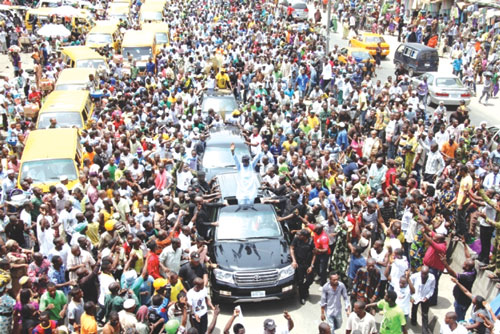 Fashola waving to the large crowd that graced his road show