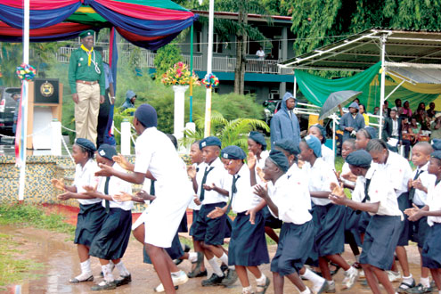 Governor Babatunde Fashola receiving compliments from children at the Children’s Day Celebration at Police College, Ikeja, Lagos, this morning. PHOTO: IDOWU OGUNLEYE.