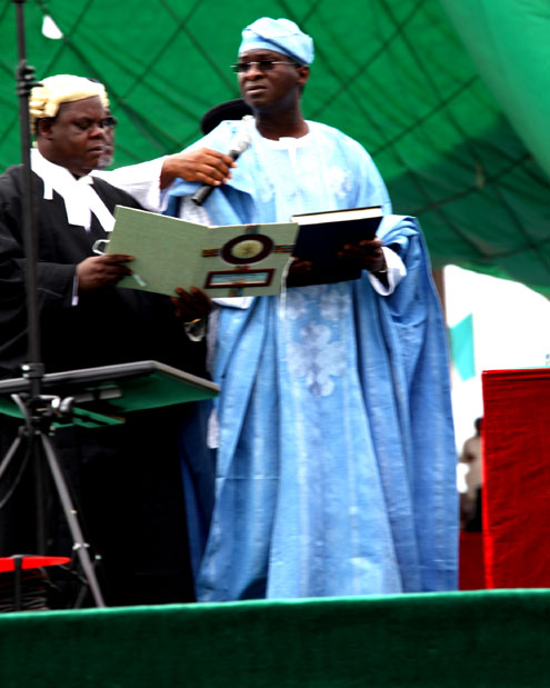 Lagos State Governor, Mr. Babatundde Fashola SAN  (right) taking his Oath of Office during the inauguration and swearing-in ceremony of the Governor for a second term in office and Mrs Adejoke Orelope-Adefulire as the Deputy Governor of Lagos State at Tafawa Balewa Square (TBS), Onikan, Lagos on  Sunday, May 29, 2011.