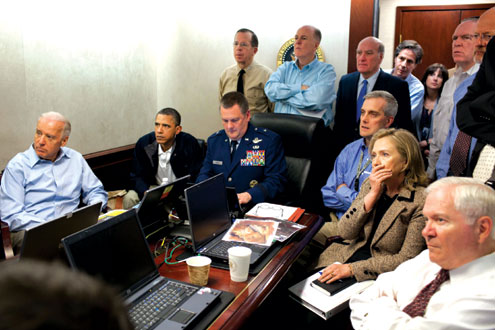 US President Barack Obama (2nd l) and Vice President Joe Biden (l), US Secretary of Defense Robert Gates (r) and US Secretary of State Hillary Clinton (2nd r) watch live along with members of the national security team, the attack on Osama bin Laden in the Situation Room of the White House, in Washington, DC on May 1, 2011. AFP PHOTO.