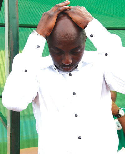 A  dejected Super Eagles’ coach, Samson Siasia after Togo beat his team on Saturday.