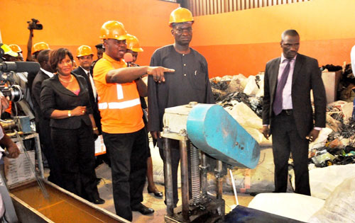 Lagos State Governor, Mr. Babatunde Fashola SAN (2nd right), being conducted round the Nylon Recycling plant during the handing over of 100 new compactor (rear loader) trucks to PSP Operators in the State by the Managing Director of Lagos State Waste Management Authority (LAWMA), Mr. Ola Oresanya (2nd left) at the Olusosun Landfill, by Motorways, 7up Lagos, on Monday, June 20, 2011.