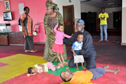 Lagos State Governor, Mr. Babatunde Fashola (SAN) with some physically challenged children when he visited the Heart of Gold Childrenâ€™s Hospice as part of activities to mark  his 48th Birthday, as it has been his tradition since assumption of office, held at Alhaji Masha Road, Surulere, on Tuesday , June 28, 2011.
