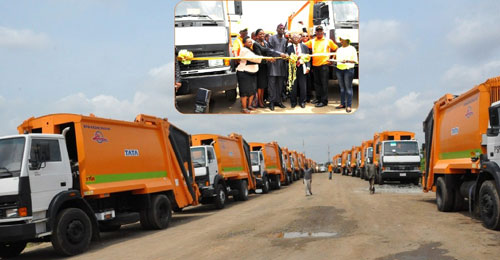 A cross section of the 100 new compactor (rear loader) trucks handed over by the Governor of Lagos State, Mr. Babatunde Fashola (SAN) to PSP Operators in the State at the Olusosun Landfill, by Motorways, 7up Lagos, on Monday, June 20, 2011. INSET: Lagos State Governor, Mr. Babatunde Fashola SAN (3rd left) cutting the ribbon during the handing over of the compactor trucks. With him are: Managing Director of Lagos State Waste Management Authority (LAWMA), Mr. Ola Oresanya (2nd right), President of Association of Waste Managers of Nigeria (AWAM) and CEO of JIMSIF Ltd, Mr. Adegboyega Adepitan (3rd right),) Managing Director of Stanbic IBTC, Mrs. Sola David-Borha (2nd left) and the Permanent Secretary, Ministry of Environment, Dr (Mrs) Titi Anababa (left).