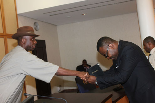 Rivers State Governor, Rt. Hon. Chibuike Rotimi Amaechi (left) congratulating Dr Chamberlain Peterside, shortly after been sworn-in as Commissioner in Government House, Port Harcourt.