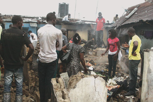 Scene of fire incident caused by playing kids at Olalubi Street, Mafoluku, Lagos, yesterday. PHOTO: KOLA ALIYU.