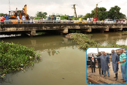 A portion of the canal in Surulere at Bode Thomas Road, during an inspection tour of areas affected by Sundayâ€™s heavy rainfall in Lagos by the Governor of Lagos State, Mr. Babatunde Fasola (SAN), on Tuesday, July 12, 2011. INSET: Lagos State Governor, Mr. Babatunde Fashola SAN (middle), Commissioner for Environment, Mr. Tunji Bello (right) and Permanent Secretary (Drainage), Ministry of Environment, Engr. Muyideen Akinsanya (left)