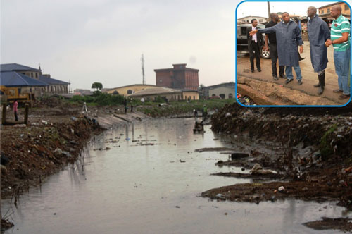 A portion of the canal in Surulere at Bode Thomas Road, during an inspection tour of areas affected by Sundayâ€™s heavy rainfall in Lagos by the Governor of Lagos State, Mr. Babatunde Fasola (SAN), on Tuesday, July 12, 2011. INSET: Lagos State Governor, Mr. Babatunde Fashola SAN (middle), Commissioner for Environment, Mr. Tunji Bello (right) and Permanent Secretary (Drainage), Ministry of Environment, Engr. Muyideen Akinsanya (left)