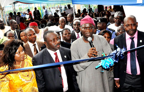 Lagos State Governor, Mr. Babatunde Fashola (right), cutting the ribbon to commission the Group Head Office of Japaul Energy and Oil Services (Japaul House) at Dr. Nurudeen Olowopopo Road, Central Business District, Ikeja, Lagos, yesterday. Managing Director/CEO Japaul Oil and Maritime Service Plc, Mr. Jegede Abiodun Paul (2nd left), his wife, Mrs. Bisilola Jegede (left) and the Managing Director, Japaul Energy SA, Mr. Adebola Olagbaju.