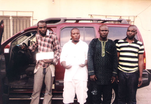 Idowu Odeyemi (l) and members of his gang after they were arrested by the police.