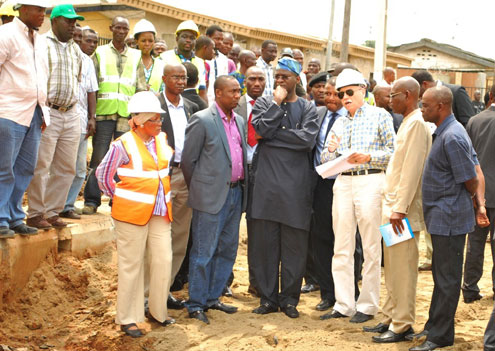 Lagos State Governor, Mr. Babatunde Fashola SAN (4th right), Site Engineer, Mr. Emil Koler (3rd right), Commissioner for Works and Infrastructure, Dr Obafemi Hamzat (2nd left) and others officials during the Governorâ€™s inspection visit to the ongoing road construction project at Akerele Street in Surulere, Lagos on Tuesday, August 9, 2011.