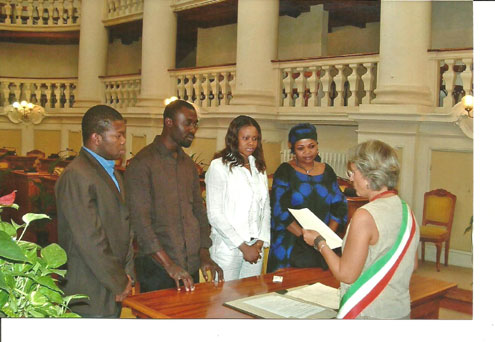 Prince Okojie and Lovely [middle] during  their wedding at an Italy Registry.