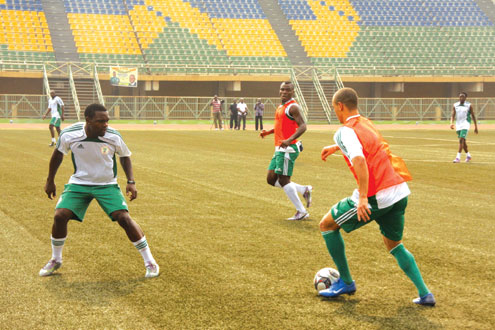Super Eagles’ Osaze Odemwingie (right) vies with the ball with Chibuzor Okonkwo (left) during a training session before their international friendly match against Sierra Leone at the Teslim Balogun Stadium, Lagos, Nigeria. Photo: Emmanuel Osodi.