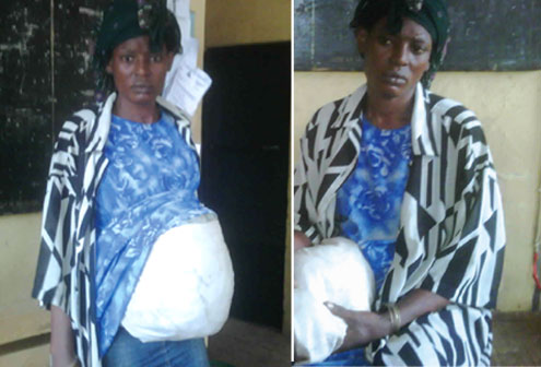 The fake pregnant woman, Kemi Durojaye, after her arrest yesterday. PHOTOS: SIMON ATEBA.