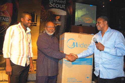 â€¢Ace actor, Taiwo Obileye (middle), receiving his prize from Mr. Sule Abiola as Funsho Ayeni, Brand Manager, Legend, looks on.