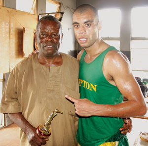 Ben Falaja (right) with dad, Abayomi Falaja at the just concluded International Amateur Boxing Show organised by the Lagos Boxing Hall of Fame. Photo: Emmanuel Osodi.