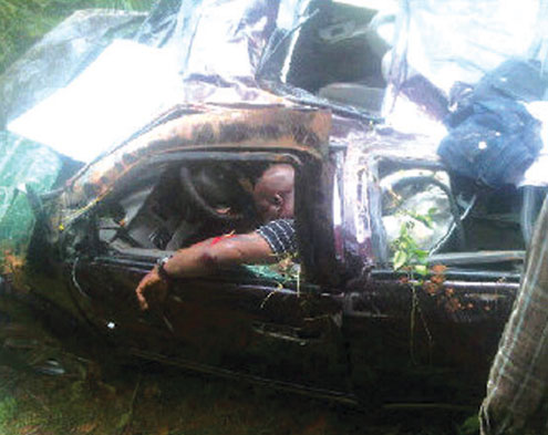 MC Loph inside  the wrecked SUV.