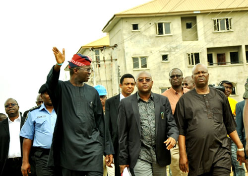Lagos State Governor, Mr. Babatunde Fashola SAN (left) with Commissioner for Housing, Mr.  Bosun Jeje (middle) and Special Adviser to the Governor on Housing, Hon. Jimoh Ajao (right), during the inspection of Gbagada Housing Estate of the Lagos State Government in Gbagada on Tuesday , October 4, 2011.